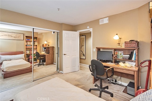 carpeted bedroom featuring a closet