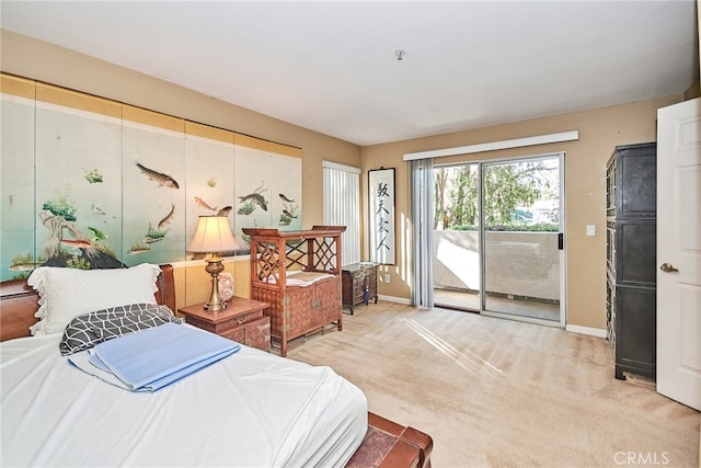 carpeted bedroom featuring access to outside