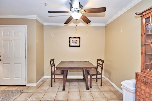 dining space with crown molding, light tile patterned flooring, and ceiling fan