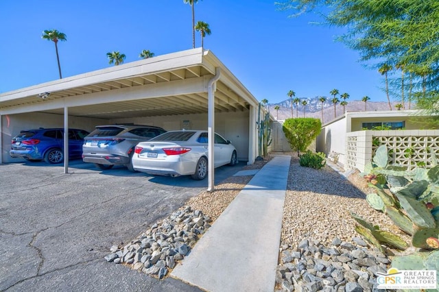 view of vehicle parking featuring a carport