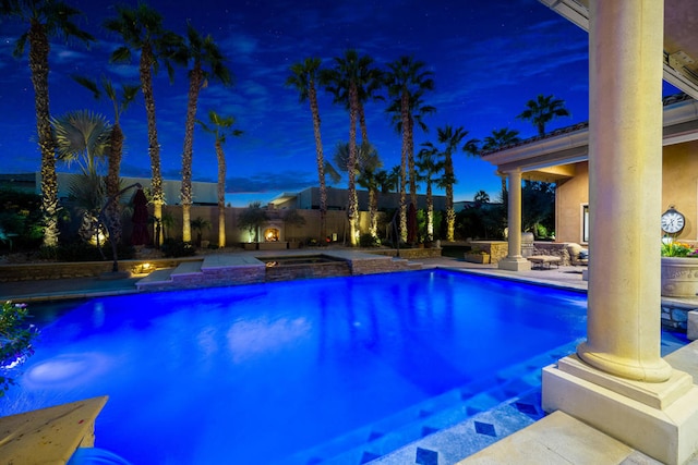 view of pool featuring an in ground hot tub and a patio