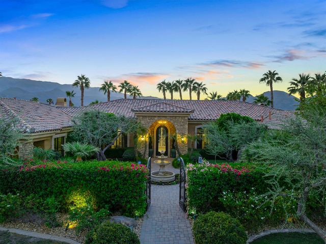 mediterranean / spanish-style house featuring a mountain view