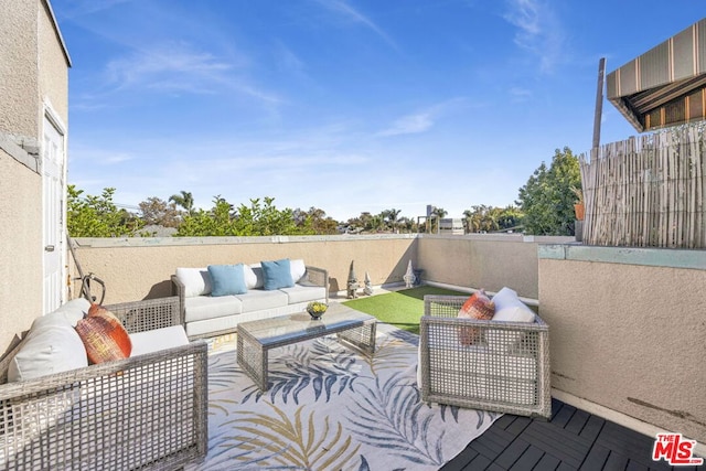 wooden deck featuring an outdoor living space