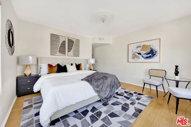 bedroom featuring hardwood / wood-style flooring