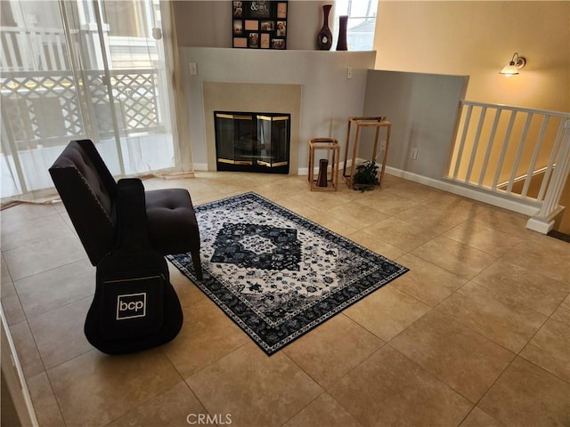 living room featuring a fireplace and tile patterned floors