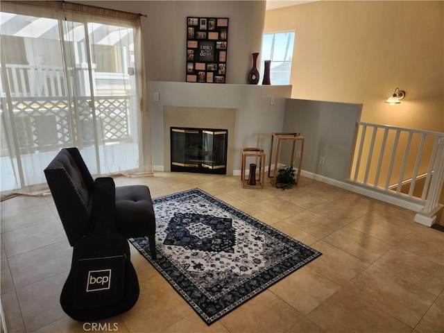 living room with tile patterned floors and a premium fireplace