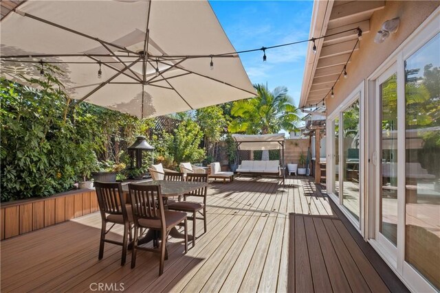 wooden deck with outdoor lounge area