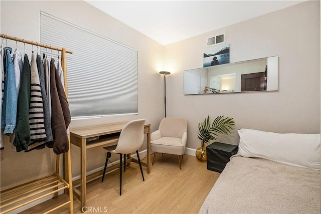 bedroom featuring hardwood / wood-style floors