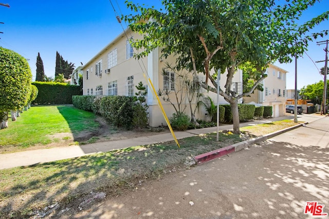 view of home's exterior featuring a lawn