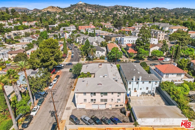 birds eye view of property with a mountain view