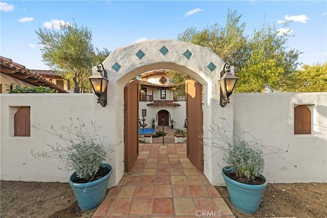 view of exterior entry featuring a patio area