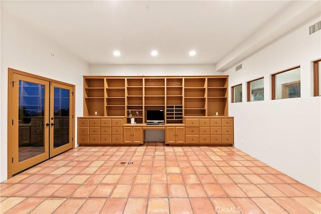 unfurnished office featuring french doors and light tile patterned flooring