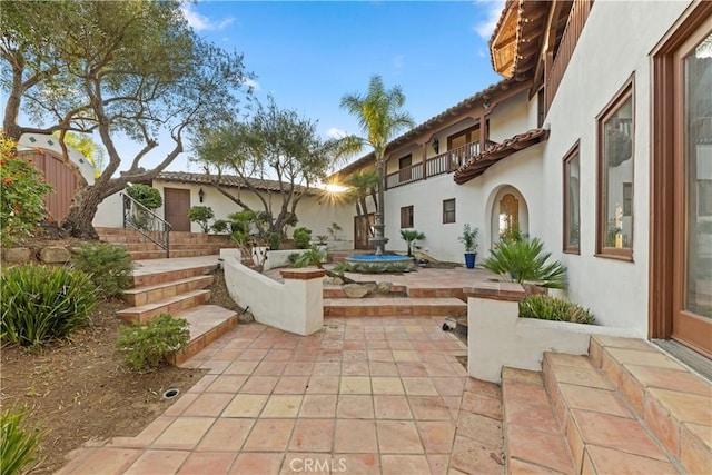 view of patio featuring a balcony