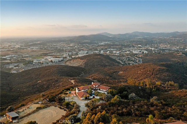 aerial view at dusk with a mountain view