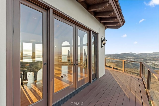 exterior space with a mountain view and french doors