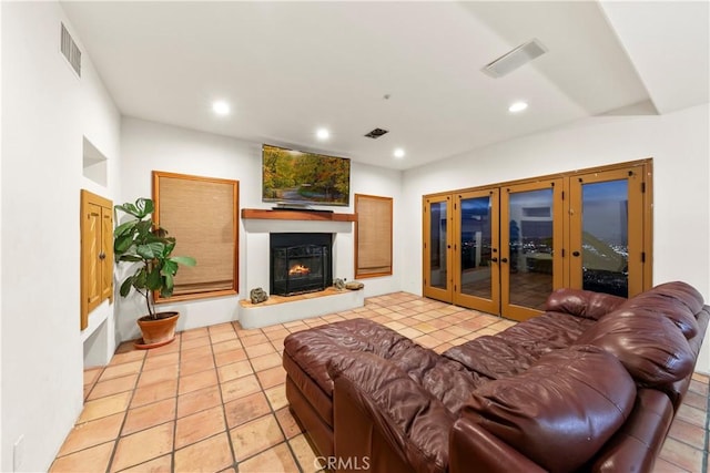 living room with light tile patterned flooring and french doors