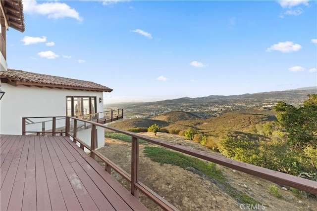 wooden terrace with a mountain view