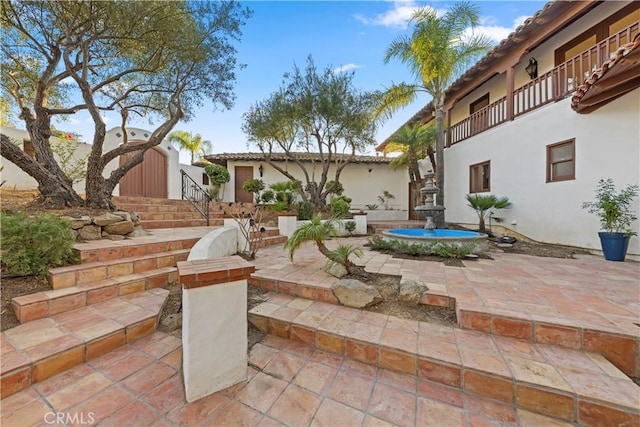 view of patio / terrace featuring a balcony