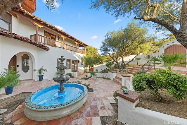 view of patio with a balcony