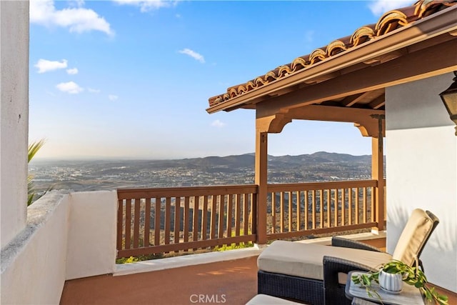 wooden terrace with a mountain view