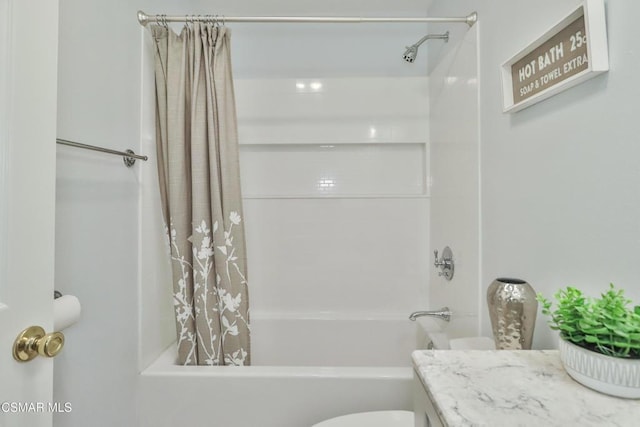 full bathroom with vanity, shower / tub combo, and toilet