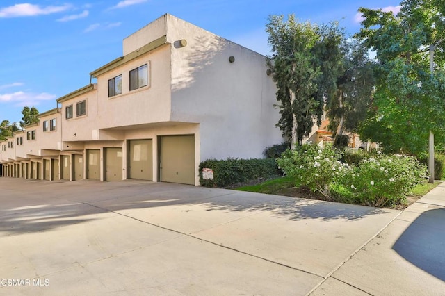 view of property exterior featuring a garage