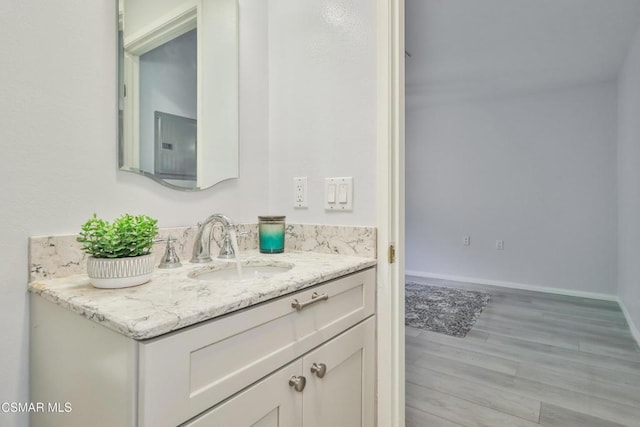 bathroom with vanity and wood-type flooring