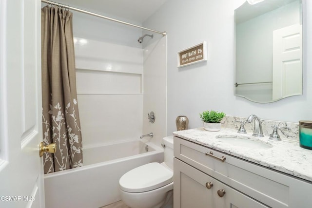 full bathroom featuring shower / bathtub combination with curtain, vanity, and toilet