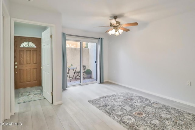 spare room featuring ceiling fan and light wood-type flooring