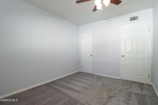 carpeted empty room with ceiling fan