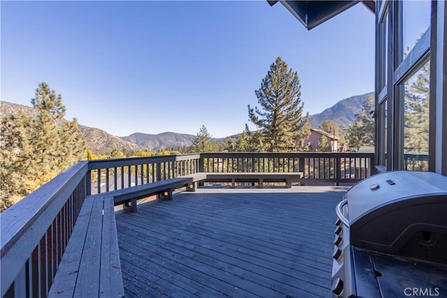 deck featuring a mountain view and grilling area