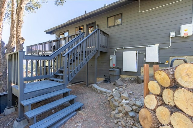 back of house featuring a wooden deck