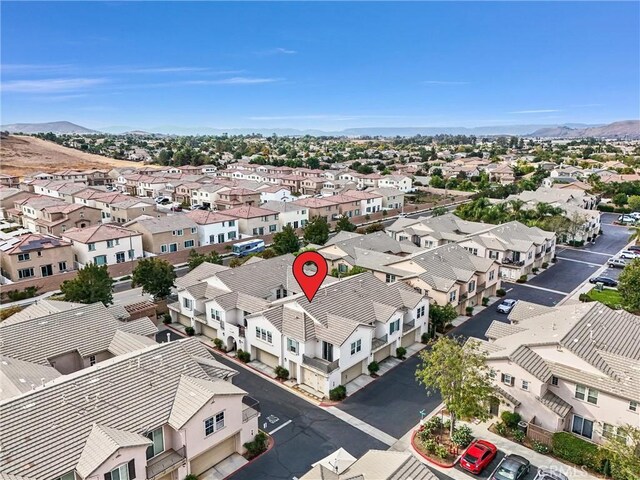 birds eye view of property featuring a mountain view