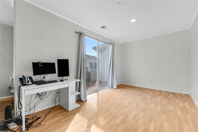 office area featuring light hardwood / wood-style floors and ornamental molding