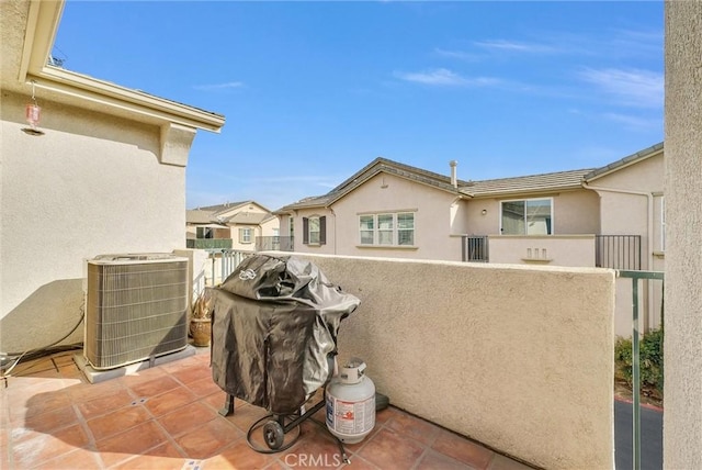 view of patio / terrace with a grill, a balcony, and central AC unit