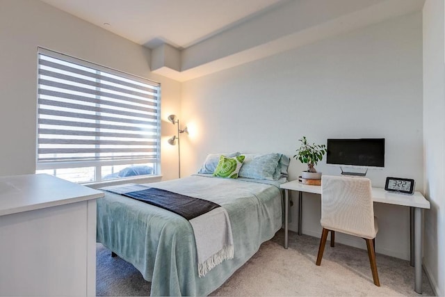 bedroom featuring light colored carpet