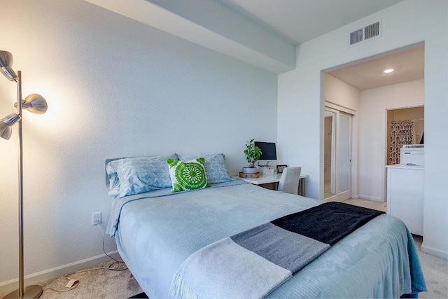 carpeted bedroom with a closet