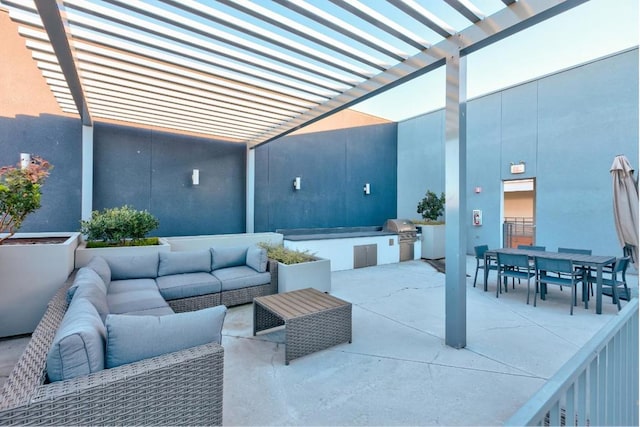 view of patio / terrace featuring an outdoor kitchen, an outdoor living space, and a grill