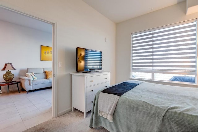 tiled bedroom featuring vaulted ceiling