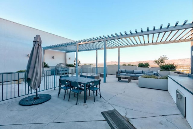 view of patio / terrace with a pergola and outdoor lounge area