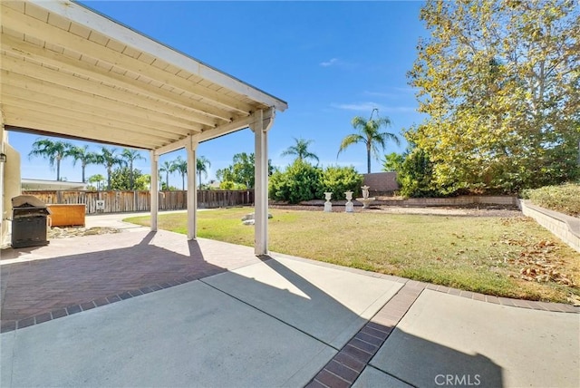 view of patio featuring a grill