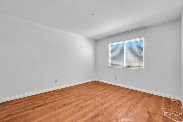 empty room with light hardwood / wood-style floors