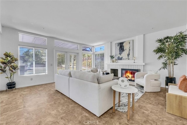 living room with a fireplace and french doors