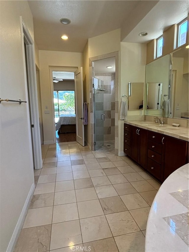 bathroom with vanity and an enclosed shower