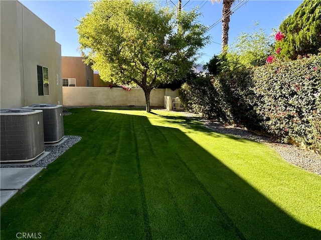 view of yard with central AC unit