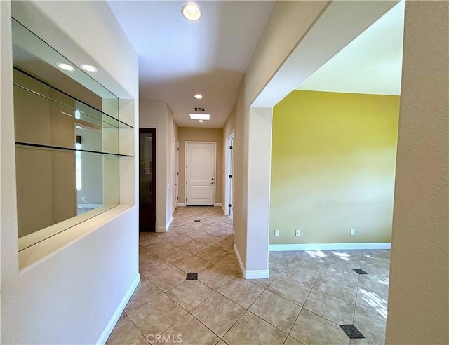 hallway with light tile patterned flooring