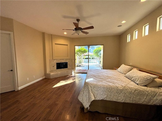 bedroom featuring ceiling fan, access to exterior, and dark hardwood / wood-style flooring