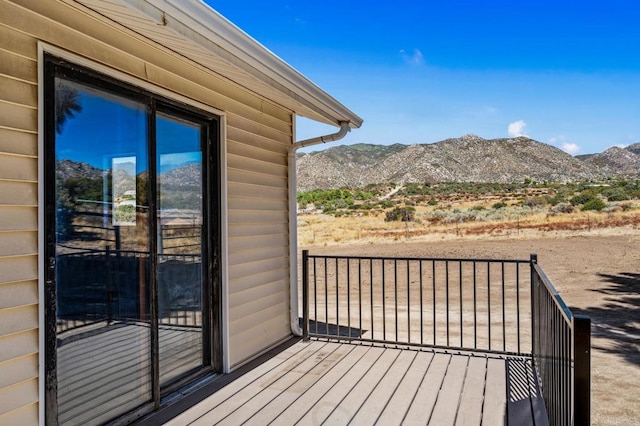 wooden terrace featuring a mountain view