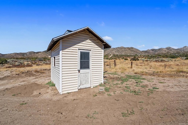 view of outbuilding featuring a mountain view