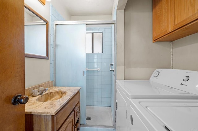 laundry room featuring independent washer and dryer and sink